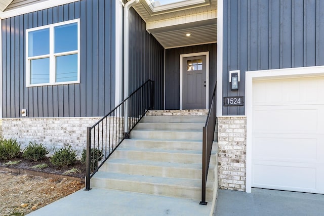 view of exterior entry featuring a garage