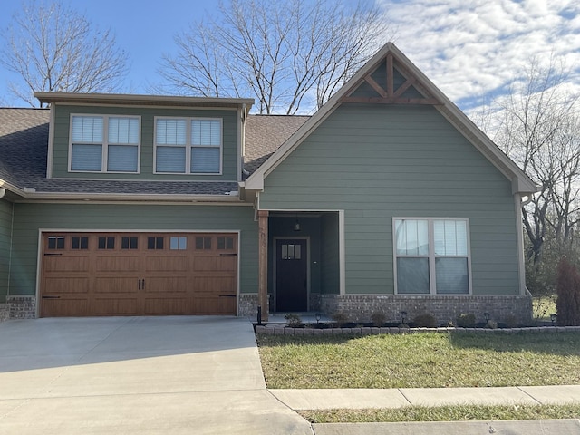 view of front of house with a front lawn and a garage