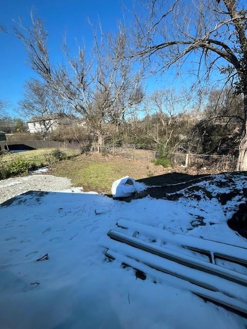 view of yard layered in snow