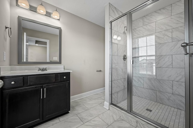 bathroom with walk in shower and vanity