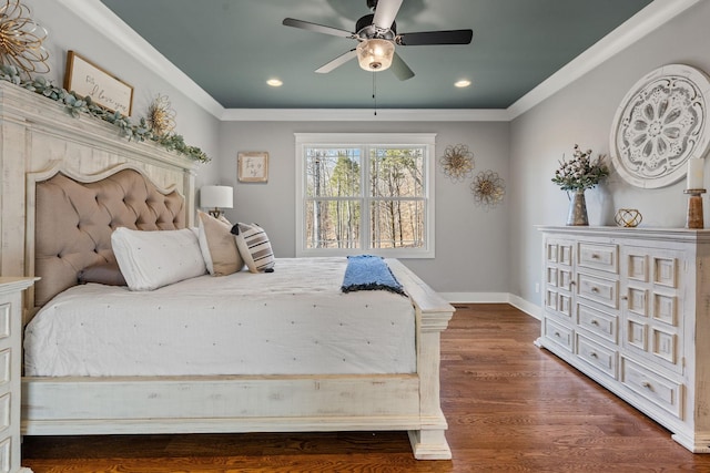 bedroom featuring ceiling fan, crown molding, and dark hardwood / wood-style flooring