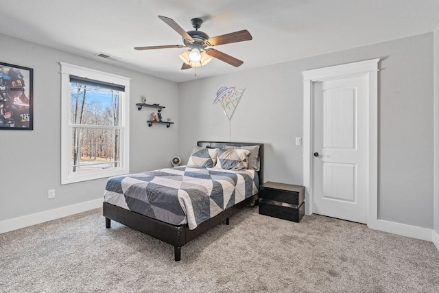 carpeted bedroom with ceiling fan