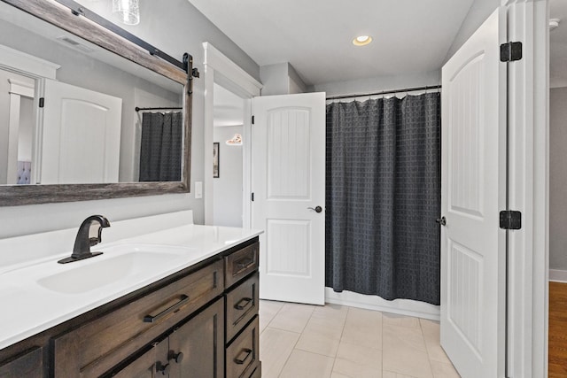 bathroom featuring vanity, tile patterned floors, and shower / bath combo