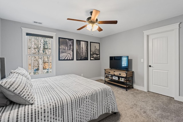 carpeted bedroom featuring ceiling fan