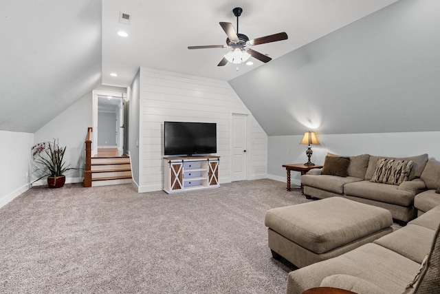 carpeted living room featuring ceiling fan and lofted ceiling