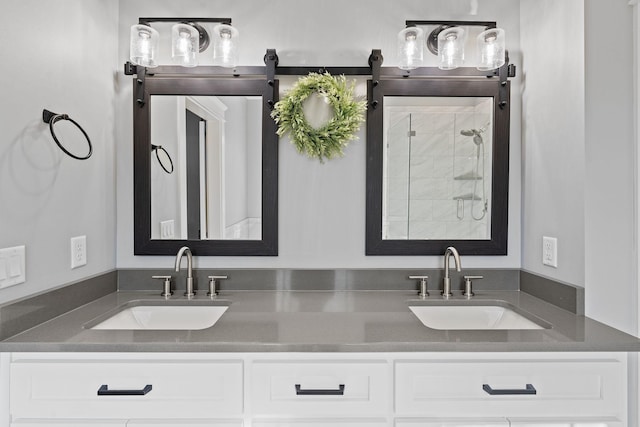 bathroom with an enclosed shower and vanity