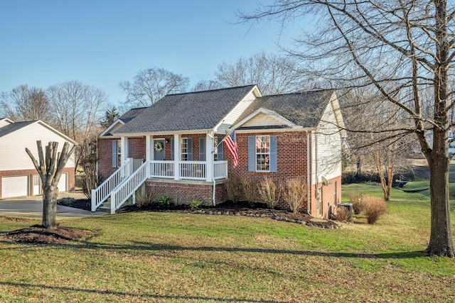 view of front of property featuring a front yard, covered porch, and a garage