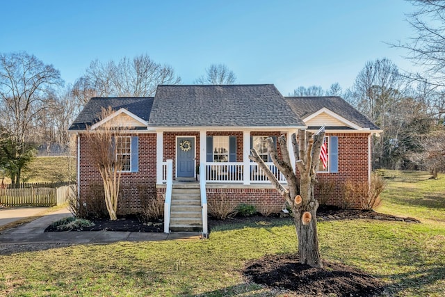 bungalow-style house featuring a porch and a front yard