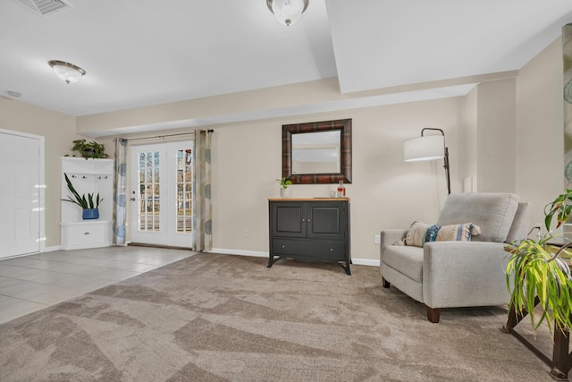 sitting room featuring tile patterned flooring