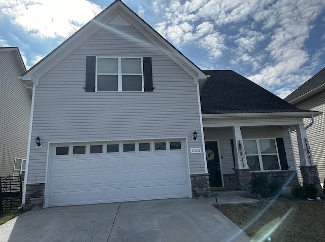 view of front of house with a porch and a garage