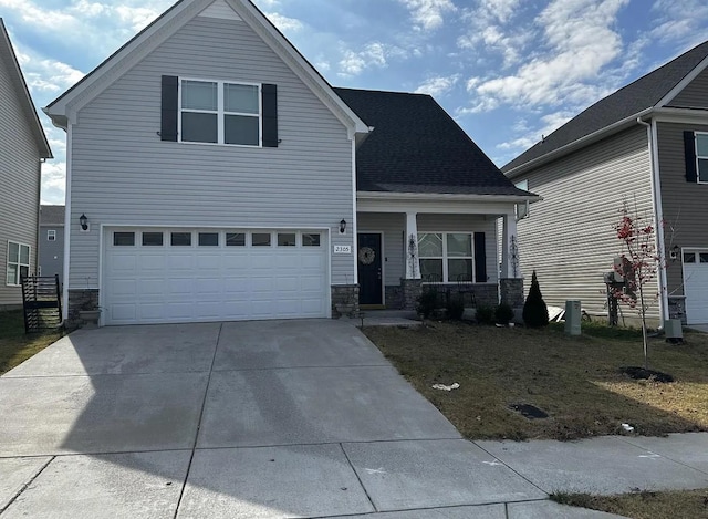 view of front property with a garage and a porch