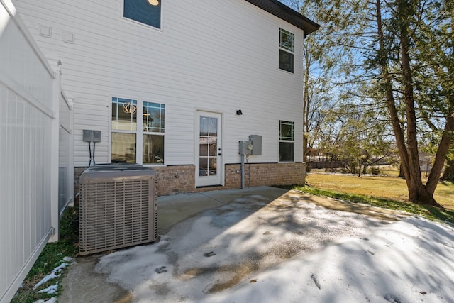 back of house featuring central air condition unit and a patio area