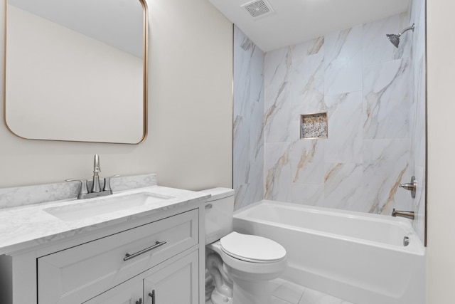 full bathroom with toilet, vanity, and tiled shower / bath