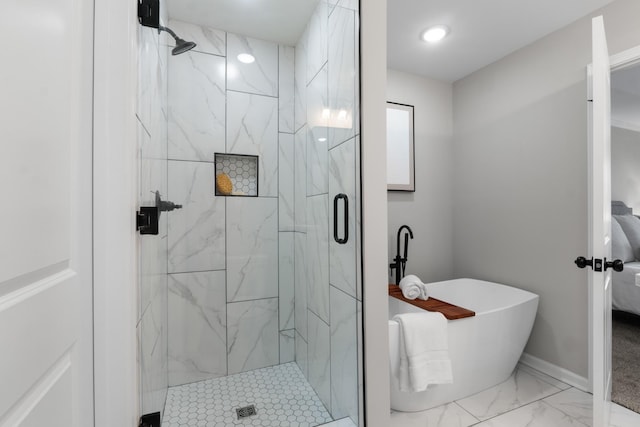 bathroom featuring separate shower and tub