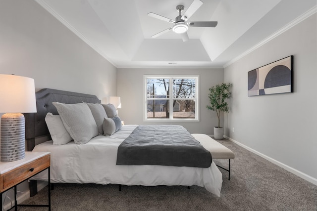 carpeted bedroom featuring ceiling fan and a tray ceiling