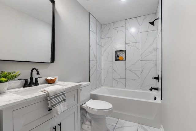 full bathroom featuring tiled shower / bath combo, vanity, and toilet