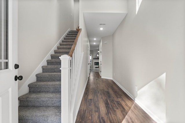 staircase featuring hardwood / wood-style flooring