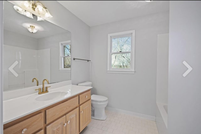 bathroom featuring toilet, tile patterned floors, and vanity