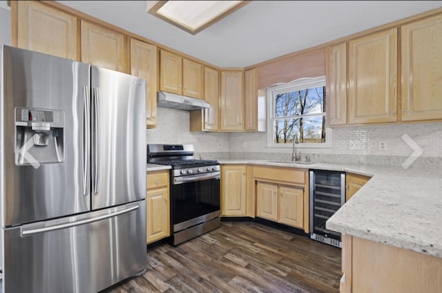 kitchen featuring stainless steel appliances, sink, light brown cabinetry, wine cooler, and dark wood-type flooring