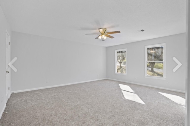 carpeted empty room featuring ceiling fan