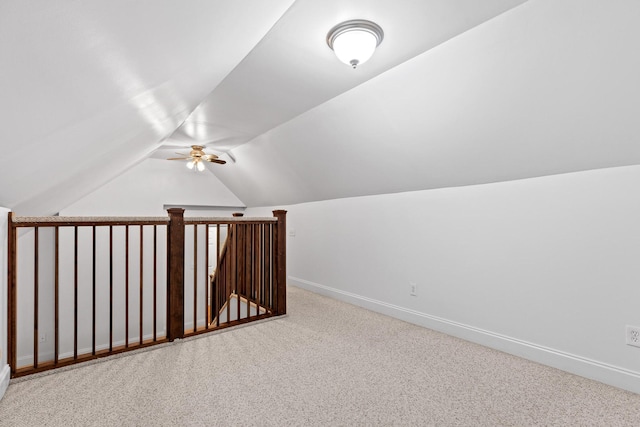 bonus room with carpet floors, ceiling fan, and vaulted ceiling