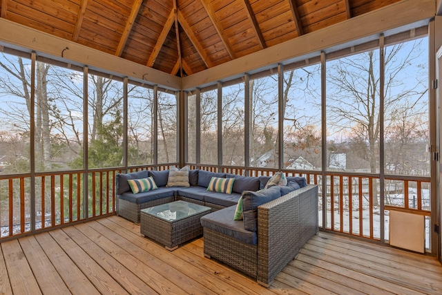 sunroom / solarium with wooden ceiling, a wealth of natural light, and vaulted ceiling with beams