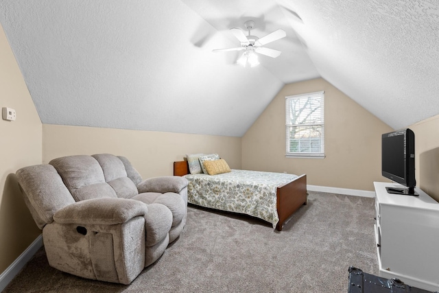 carpeted bedroom with lofted ceiling, a textured ceiling, and ceiling fan