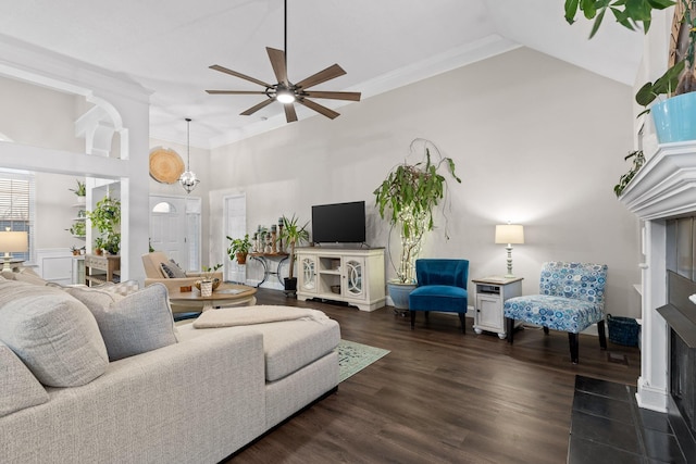 living room featuring dark wood-type flooring and ceiling fan