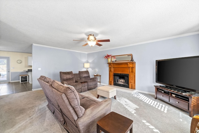 carpeted living room with ceiling fan, crown molding, and heating unit