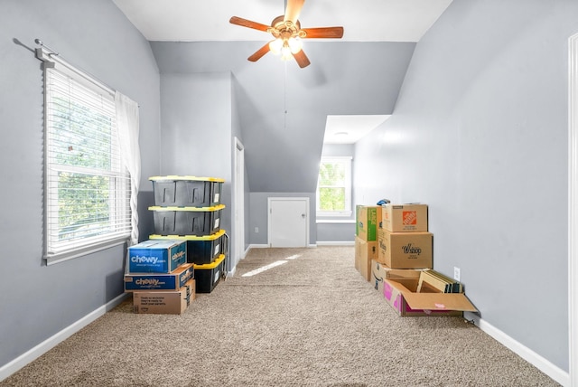 playroom featuring ceiling fan, vaulted ceiling, and carpet