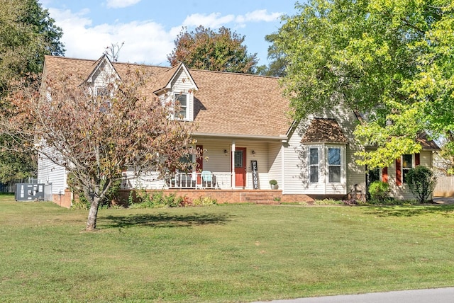 cape cod house with a porch and a front yard