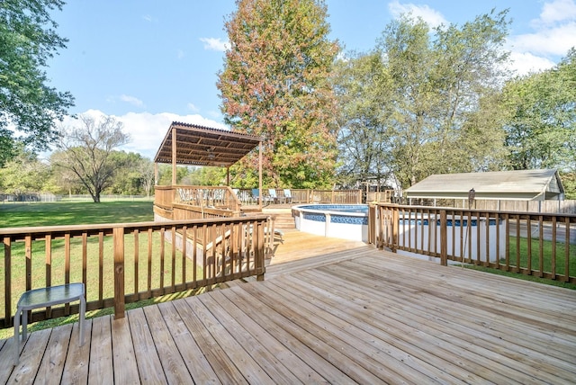 deck featuring a lawn and a fenced in pool