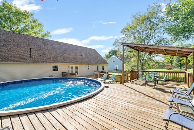 view of swimming pool featuring a deck