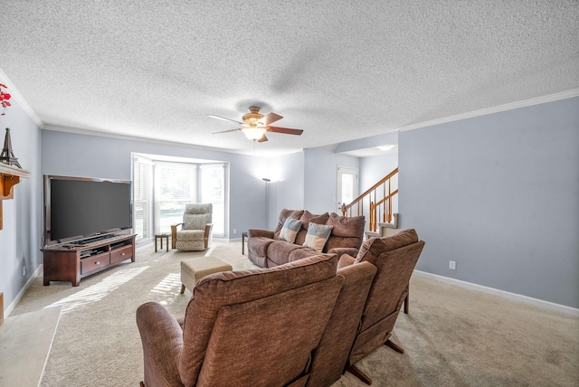 living room with ceiling fan, light carpet, crown molding, and a textured ceiling