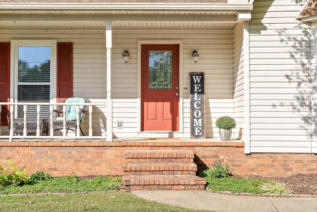 doorway to property featuring covered porch