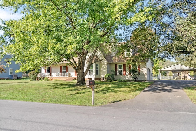 view of property hidden behind natural elements featuring a garage, a carport, and a front lawn