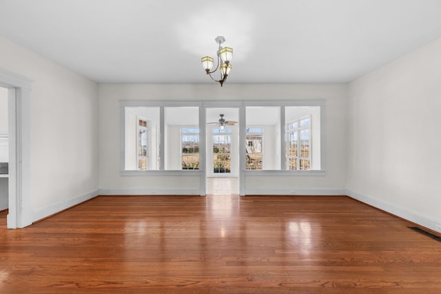 interior space with wood-type flooring and a notable chandelier