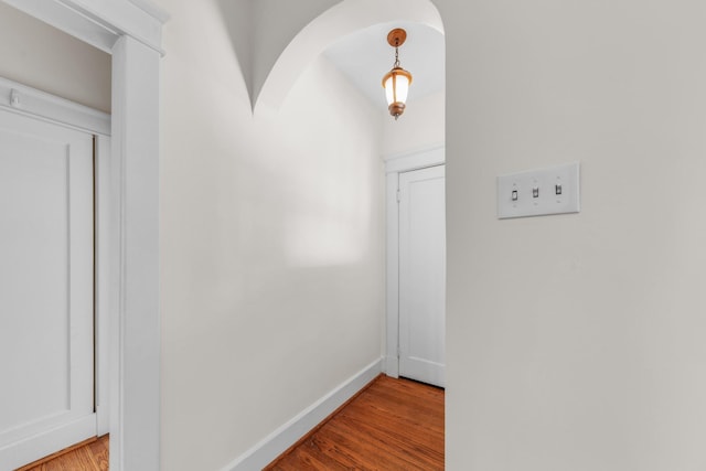 corridor with light hardwood / wood-style floors