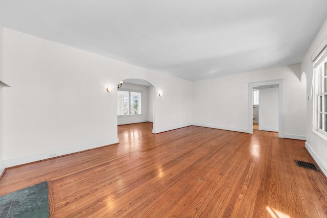 unfurnished living room with light wood-type flooring