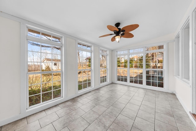 unfurnished sunroom with ceiling fan