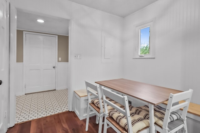 dining room with dark hardwood / wood-style flooring