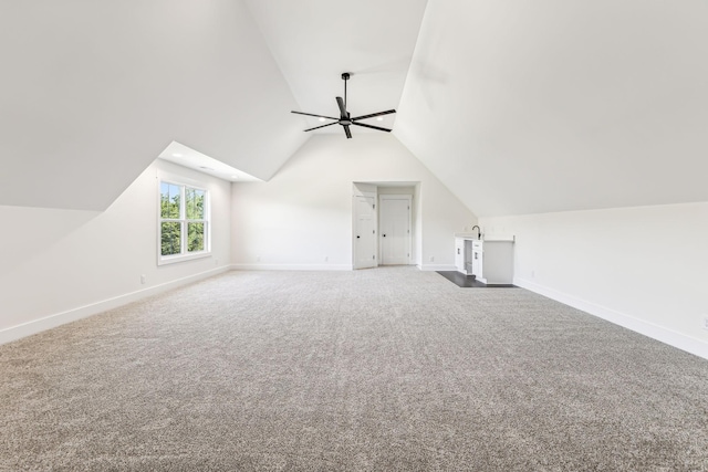 bonus room with lofted ceiling, ceiling fan, and carpet