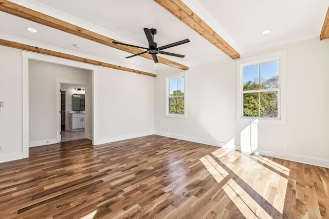 spare room with ceiling fan, beamed ceiling, and dark hardwood / wood-style floors