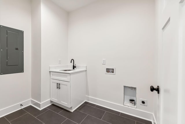 laundry room featuring electric panel, hookup for a washing machine, dark tile patterned flooring, and electric dryer hookup