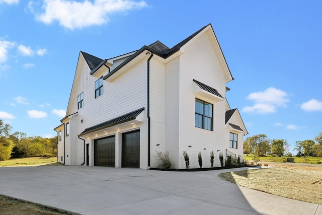 view of side of home featuring a garage