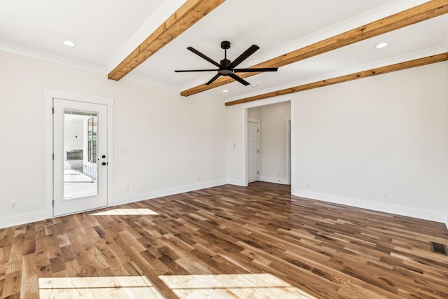 spare room featuring dark hardwood / wood-style flooring, ceiling fan, ornamental molding, and beam ceiling