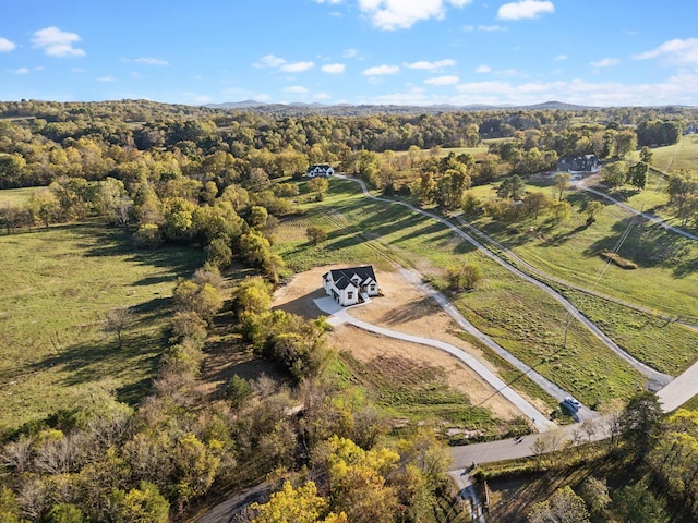 birds eye view of property featuring a rural view