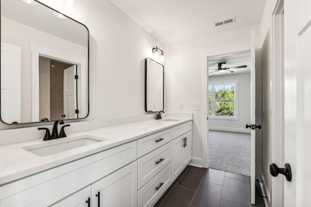 bathroom with ceiling fan, tile patterned floors, and vanity