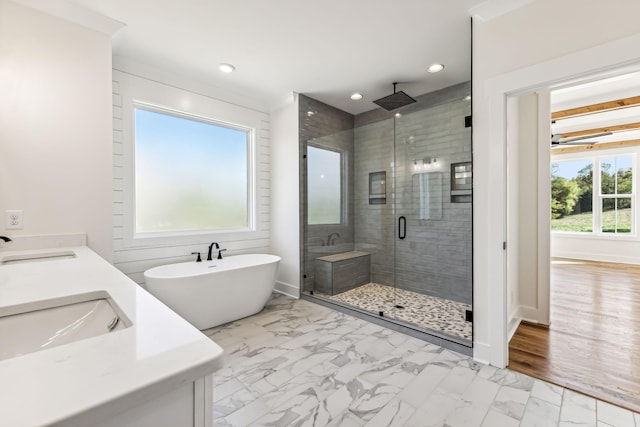 bathroom with vanity and separate shower and tub