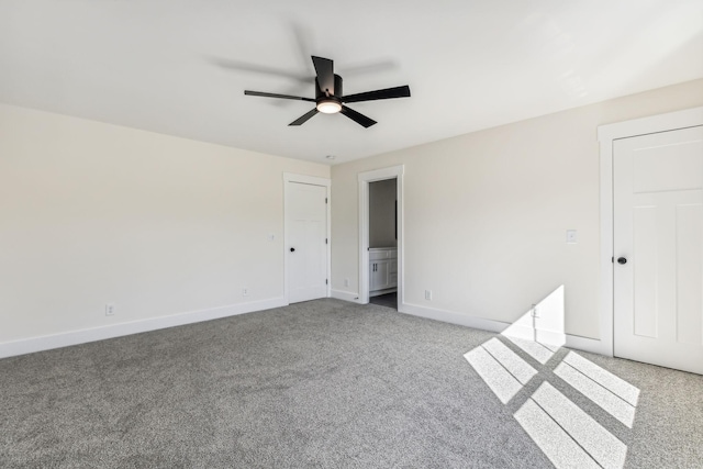 unfurnished bedroom featuring light colored carpet, ceiling fan, and connected bathroom